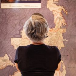 Visitor looking at large map at Bears Ears Education Center