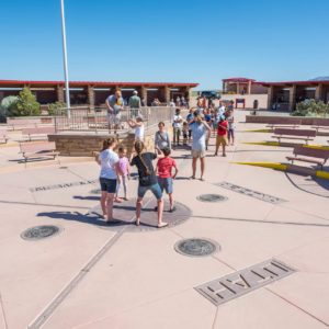 PHotographing a family at Four Corners Monument Navajo Tribal Park